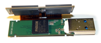 Bare internals of a 256GB USB flash drive showing 4 NAND chips